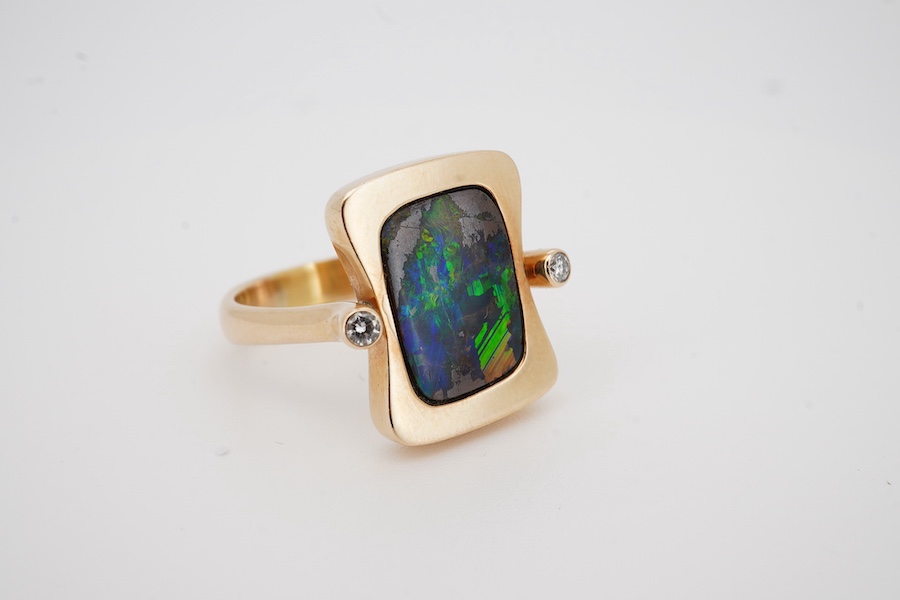 A modern Danish 14k, single stone black opal doublet? and two stone diamond set shaped rectangular ring, by Gabrielsen, size P, gross weight 9 grams. Condition - good